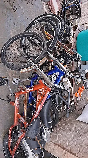 vintage black orange and blue chopper style bikes